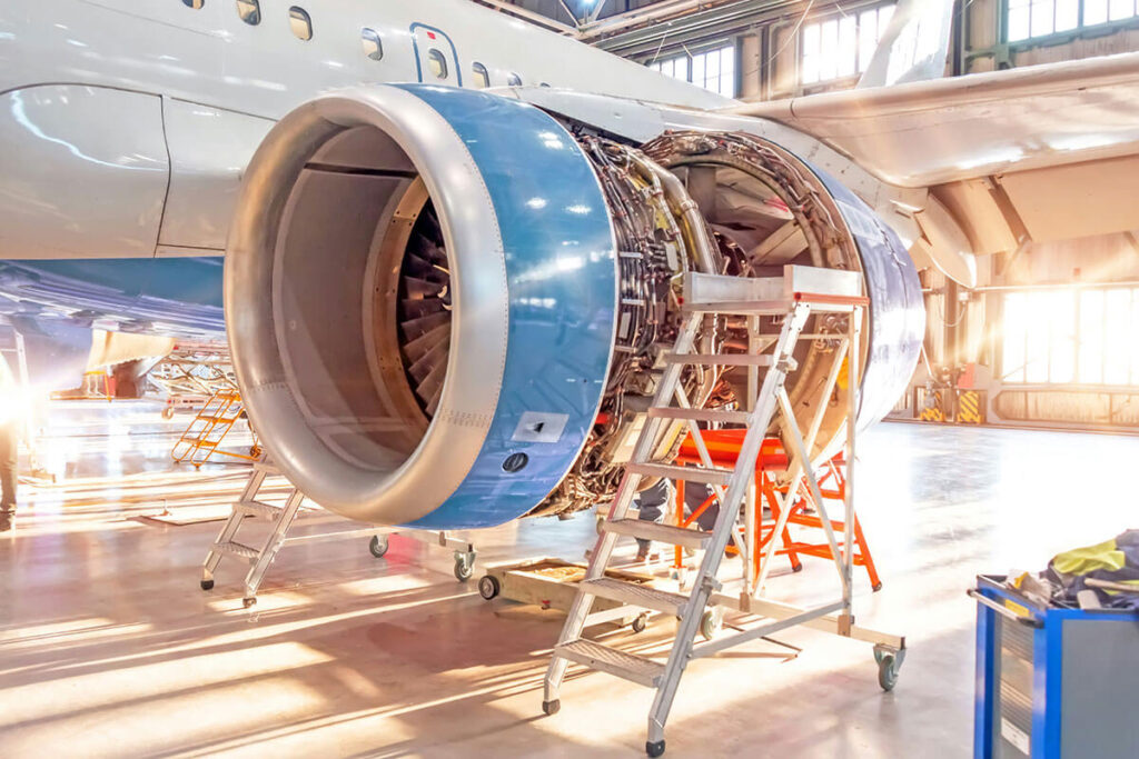 The engine of a plane being inspected.